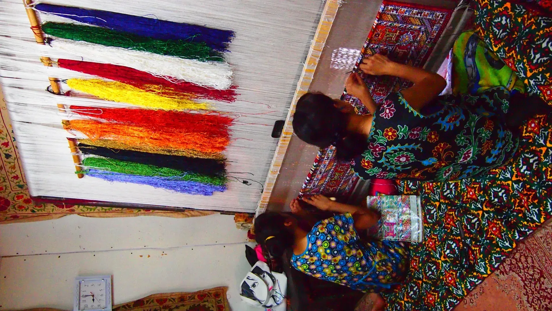 Silk weaving artisans at traditional loom